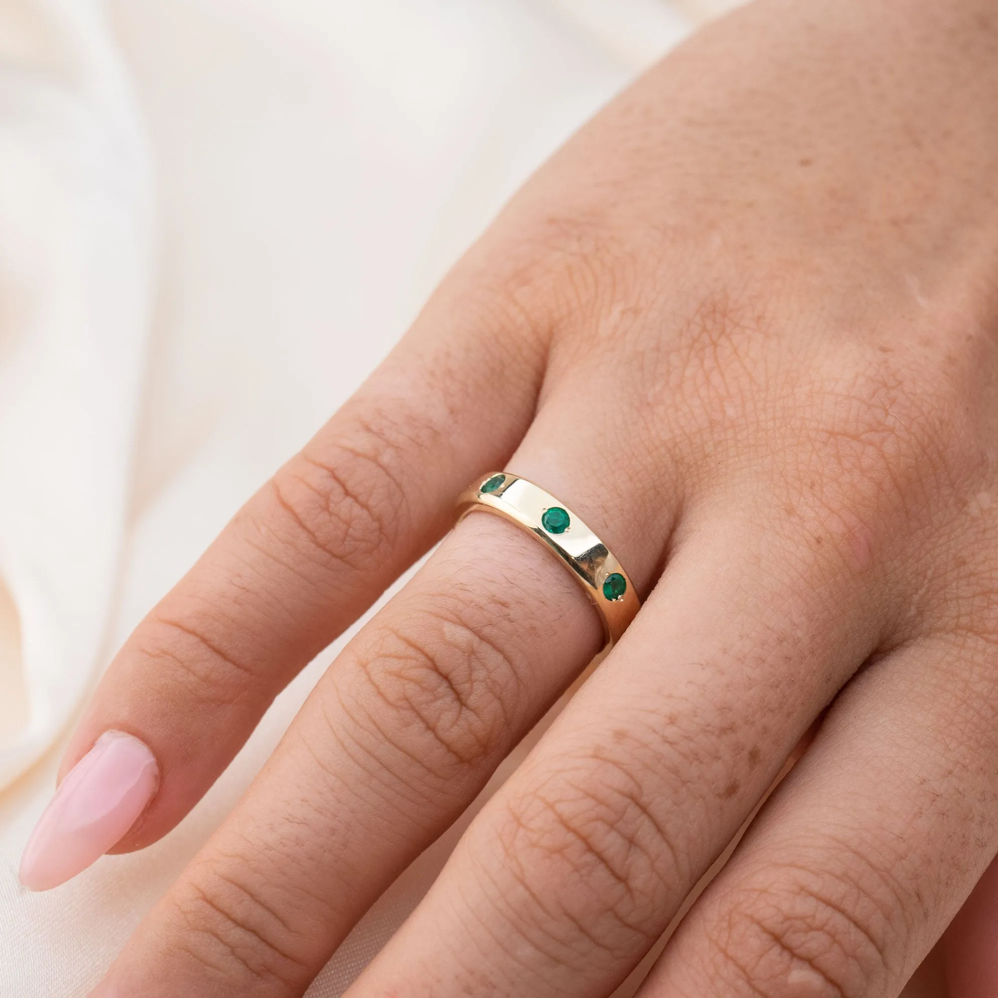 14k Gypsy Set Emerald Eternity Band